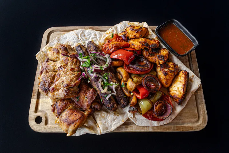 Grilled meats and camp meal served during a Georgia training week